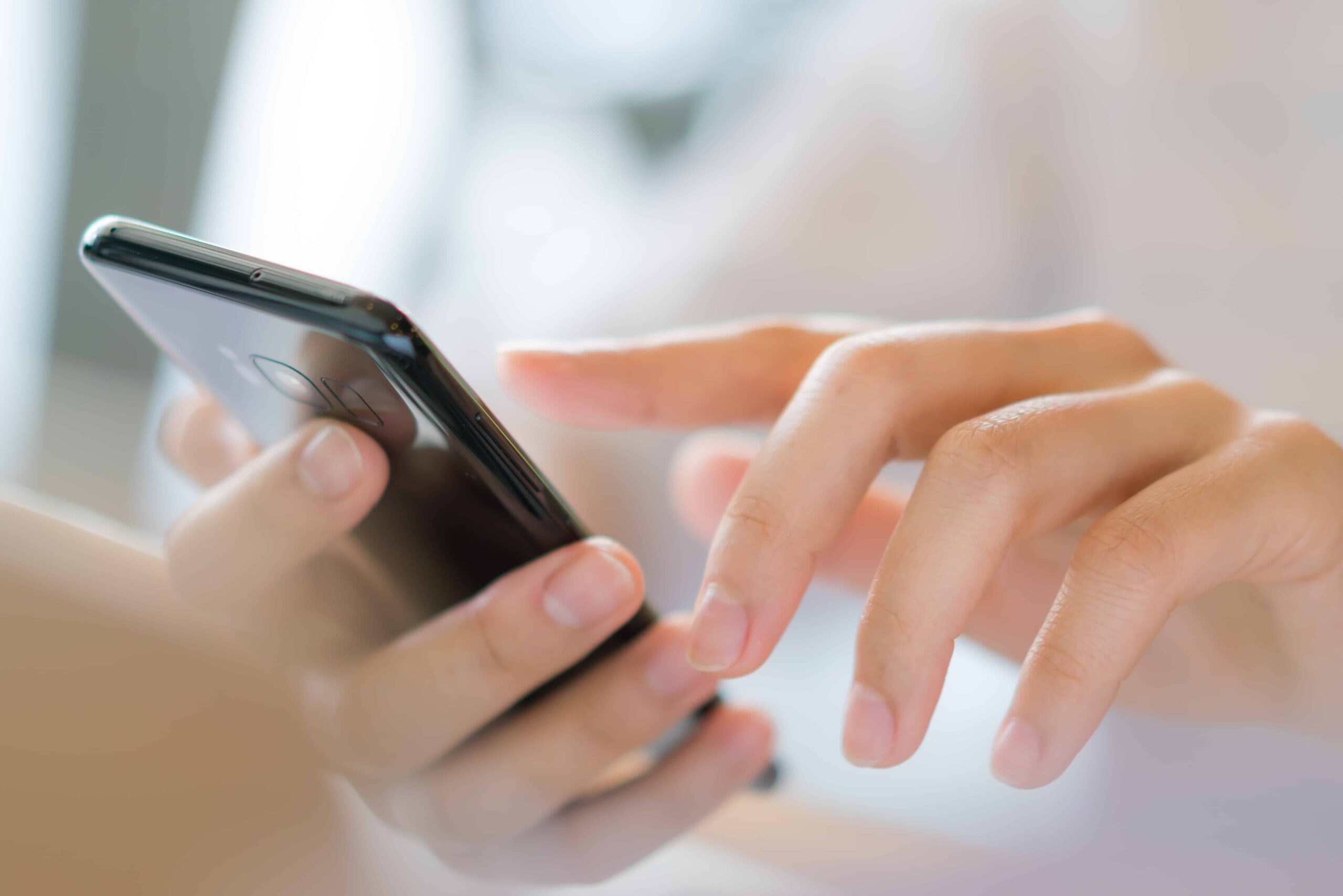 Business hand with mobile phone